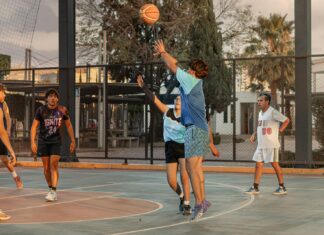 Pragmatic Play Slots Sites and Game Reviews High-energy outdoor basketball game with players shooting and defending on a street court.