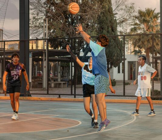 Pragmatic Play Slots Sites and Game Reviews High-energy outdoor basketball game with players shooting and defending on a street court.