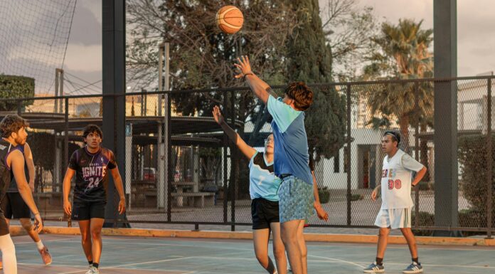 Pragmatic Play Slots Sites and Game Reviews High-energy outdoor basketball game with players shooting and defending on a street court.
